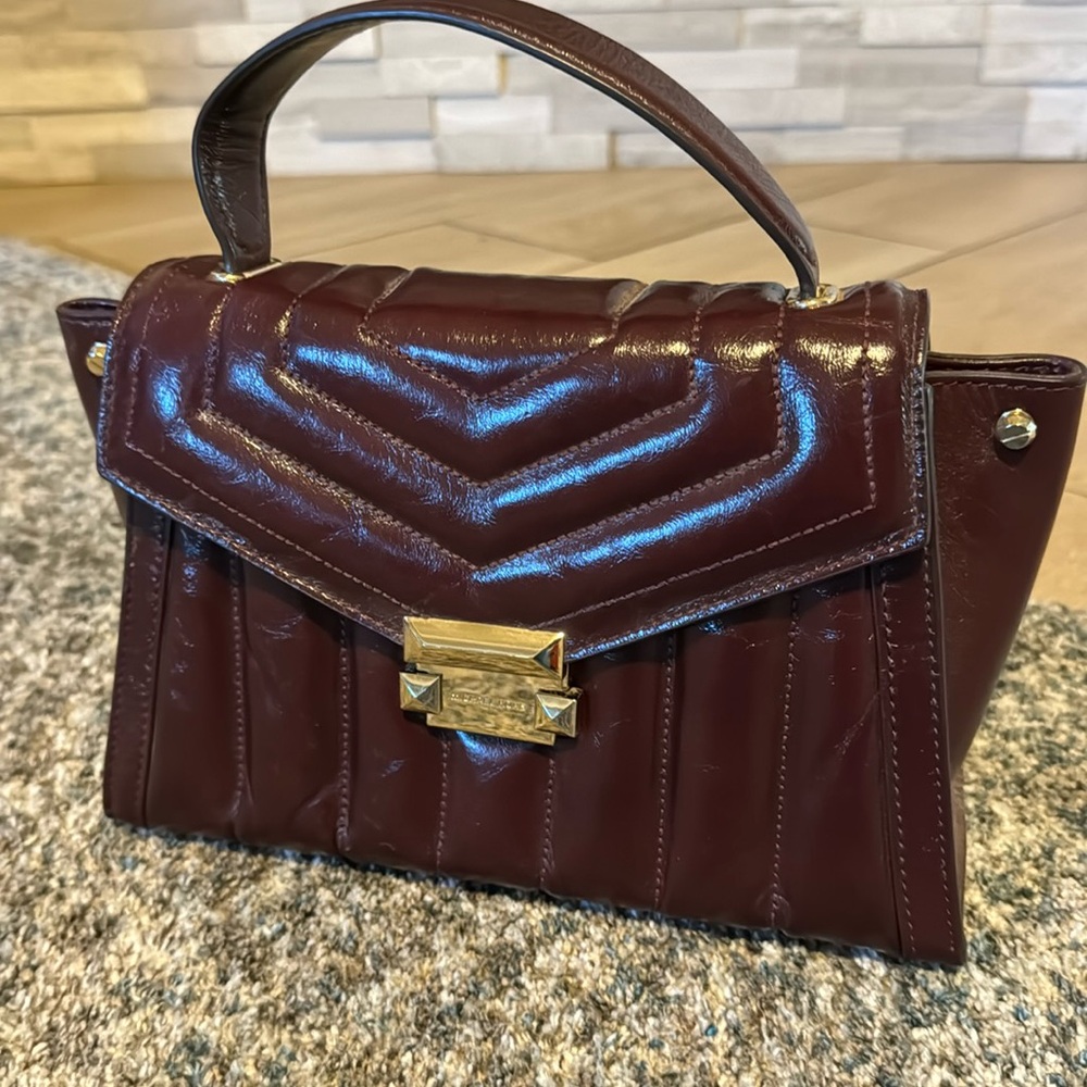 Michael Kors purse. Leather. Maroon color. Perfect condition. Only used once!